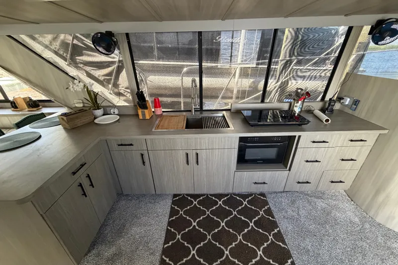 Slide: The Image of Modern kitchen interior of 1987 Bluewater Yachts Coastal Cruiser 51 with sleek cabinetry. - 38