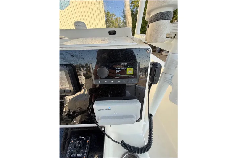 Slide: The Image of The image shows the dashboard of a 2004 Sea Fox 257 Center Console boat with a Garmin device. - 5