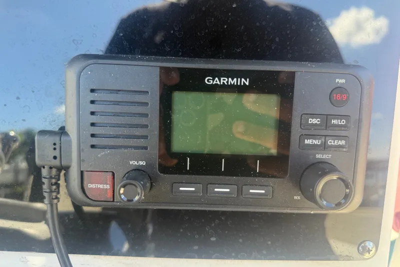 Slide: The Image of Garmin marine radio on 2004 Sea Fox 257 Center Console boat dashboard. - 24