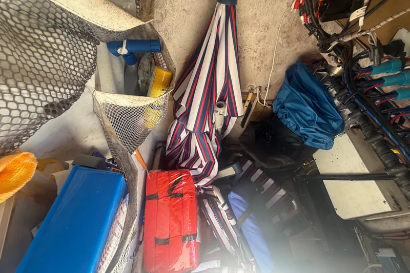 Slide: The Image of Storage area on a 2004 Sea Fox 257 Center Console boat with various equipment. - 32