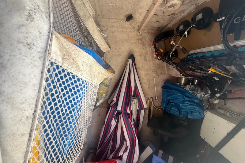 Slide: The Image of Interior storage area of a 2004 Sea Fox 257 Center Console boat with various equipment. - 31