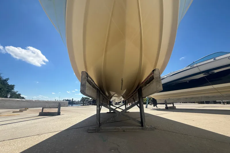 Slide: The Image of 2004 Sea Fox 257 Center Console boat on dry dock under clear blue sky. - 14