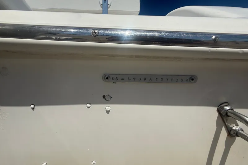 Slide: The Image of 2004 Sea Fox 257 Center Console boat with visible hull identification number. - 55