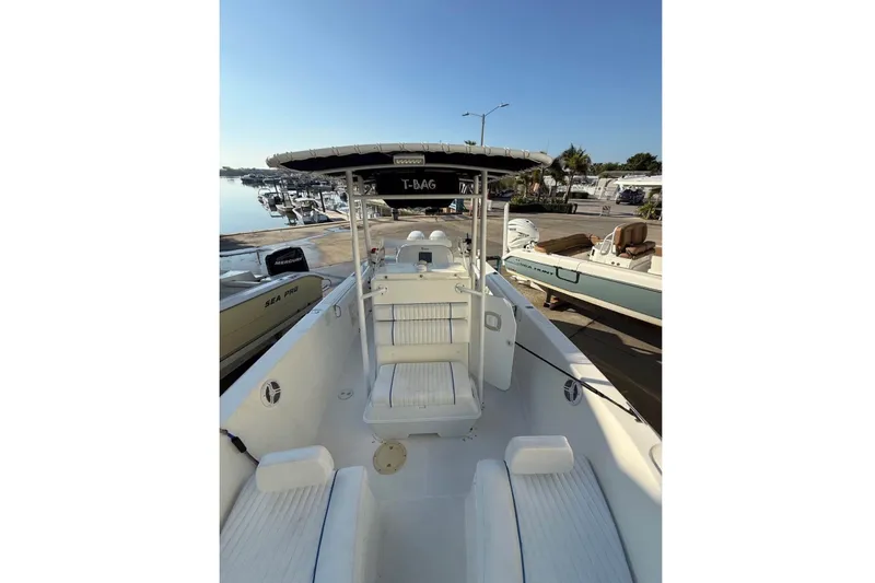 Slide: The Image of A 2004 Sea Fox 257 Center Console boat with white interior and helm station. - 18