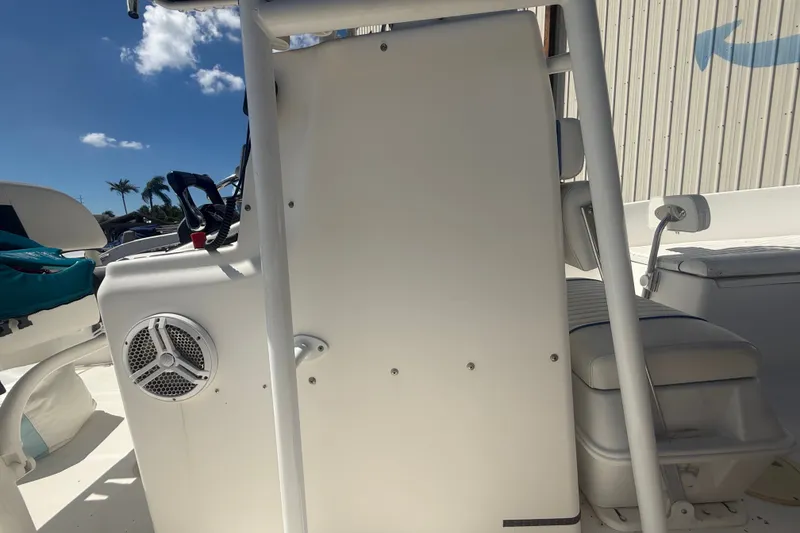 Slide: The Image of 2004 Sea Fox 257 Center Console boat interior with seating and speaker. - 42