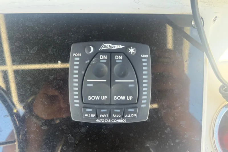 Slide: The Image of Bennett auto tab control panel on 2004 Sea Fox 257 Center Console boat. - 26