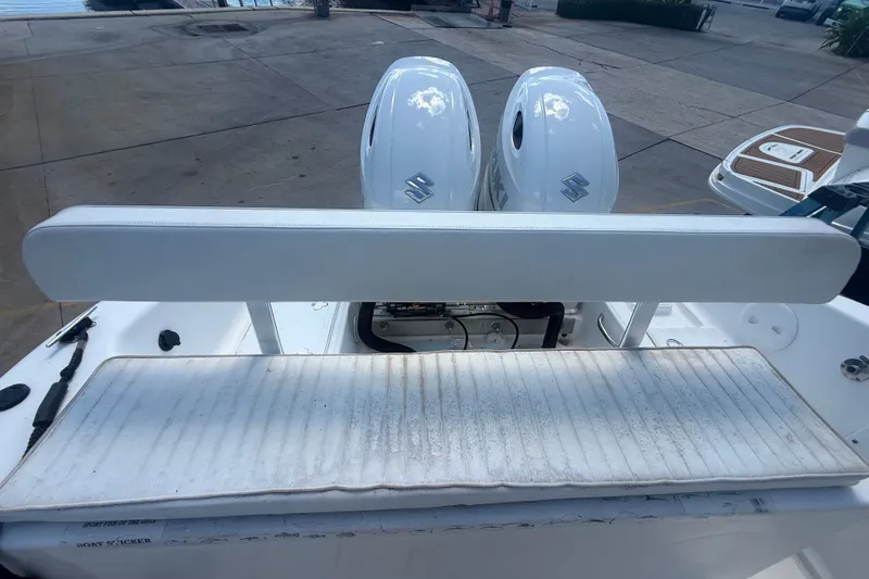 Slide: The Image of 2004 Sea Fox 257 Center Console boat with dual Suzuki engines at dock. - 50