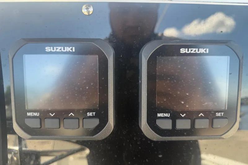 Slide: The Image of Suzuki digital displays on a 2004 Sea Fox 257 Center Console boat dashboard. - 23