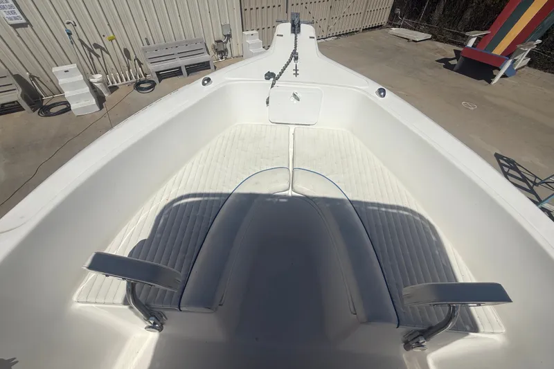 Slide: The Image of 2004 Sea Fox 257 Center Console boat interior with seating and storage compartments. - 33