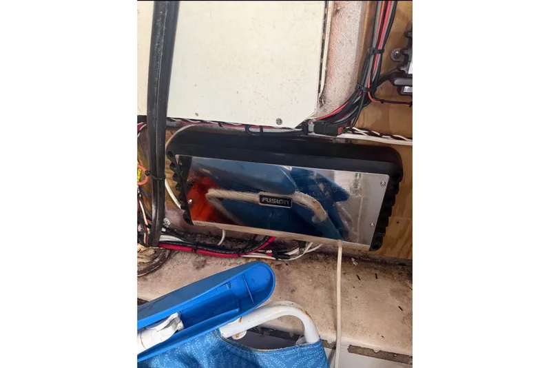 Slide: The Image of Electronics panel in a boat with wiring and a Fusion device. - 14