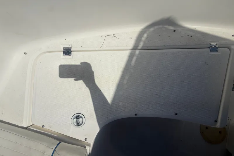 Slide: The Image of A shadow of a person taking a photo on a boat is visible. - 36