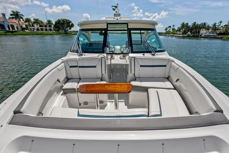 Slide: The Image of 2020 Tiara 38 LX boat interior with luxurious seating and scenic water view. - 14