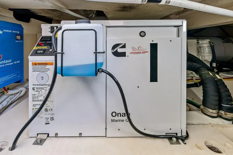 Slide: The Image of Cummins Onan marine generator in a 2020 Tiara 38 LX boat engine room. - 33