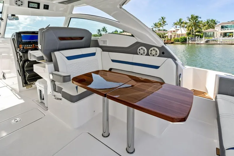 Slide: The Image of Luxurious interior of 2020 Tiara 38 LX yacht with elegant seating and wooden table. - 18