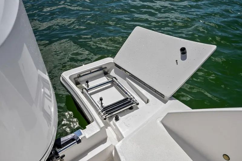 Slide: The Image of Swim platform with ladder on 2020 Tiara 38 LX boat, floating on water. - 22