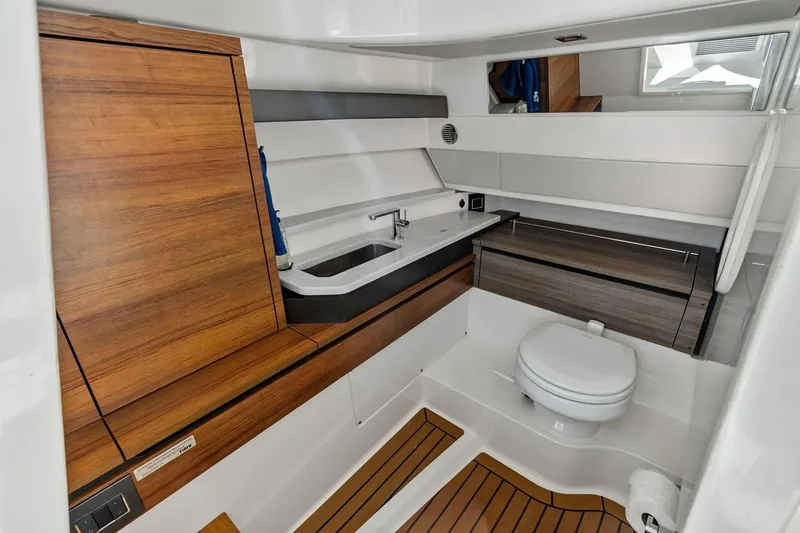 Slide: The Image of Luxurious 2020 Tiara 38 LX yacht bathroom with modern wood accents and sleek fixtures. - 31