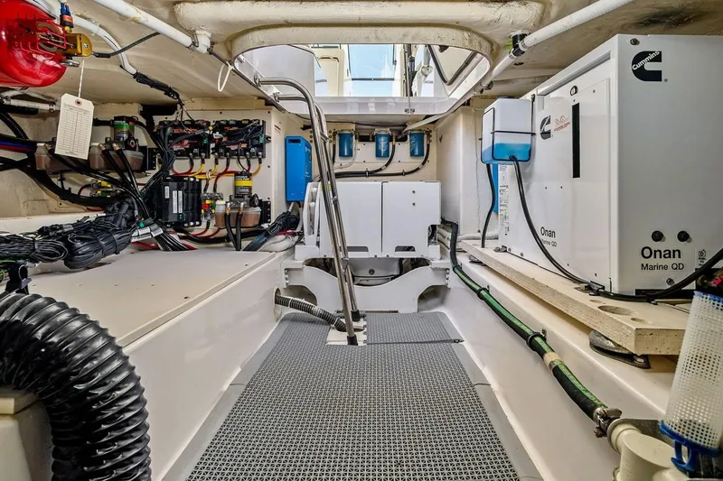 Slide: The Image of Engine room of a 2020 Tiara 38 LX boat, featuring Onan Marine QD generator. - 34