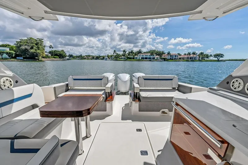 Slide: The Image of Luxurious 2020 Tiara 38 LX yacht interior with scenic waterfront view. - 19