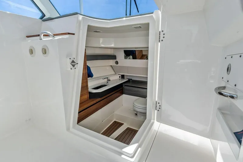 Slide: The Image of Interior view of 2020 Tiara 38 LX yacht bathroom with modern fixtures and sleek design. - 30