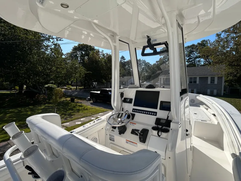 Slide: The Image of The image shows the cockpit of a 2020 Regulator 23 boat with modern controls. - 19