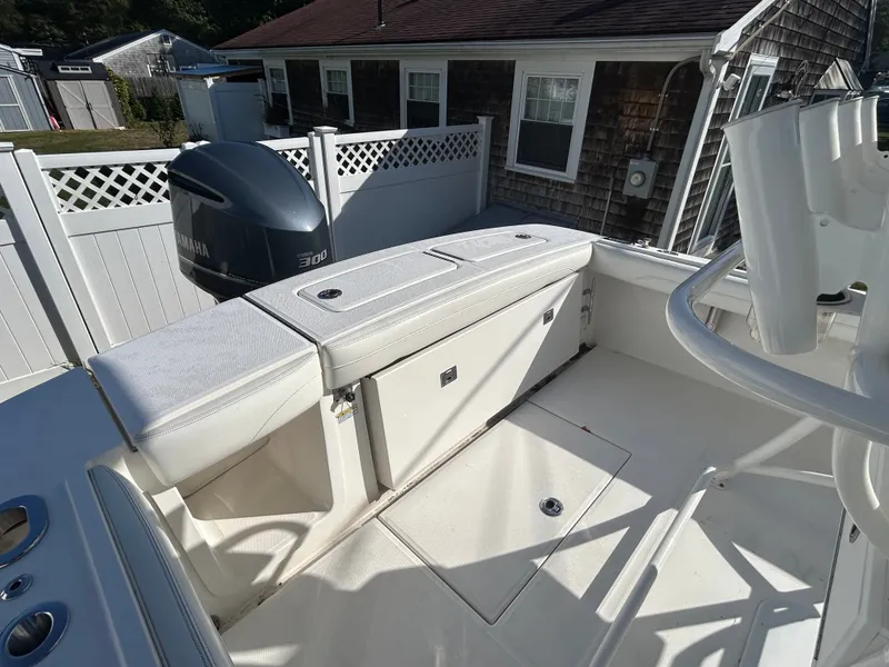 Slide: The Image of The image shows the stern of a 2020 Regulator 23 boat with a Yamaha 300 engine. - 22