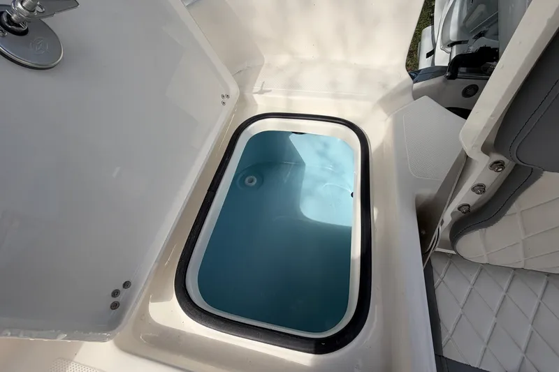 Slide: The Image of Livewell compartment on a 2027 Pioneer 220 Bay Sport boat, featuring a clean, modern design. - 20