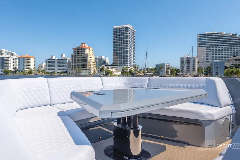 Slide: The Image of Luxurious 2025 Vanquish Yachts VQ55 with sleek seating, city skyline backdrop. - 23