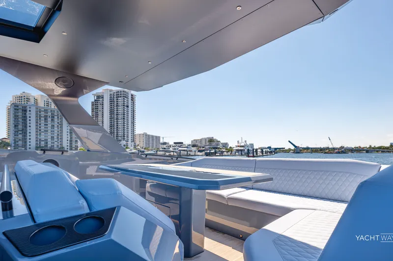 Slide: The Image of Luxurious 2025 Vanquish Yachts VQ55 interior with modern seating and waterfront city view. - 20