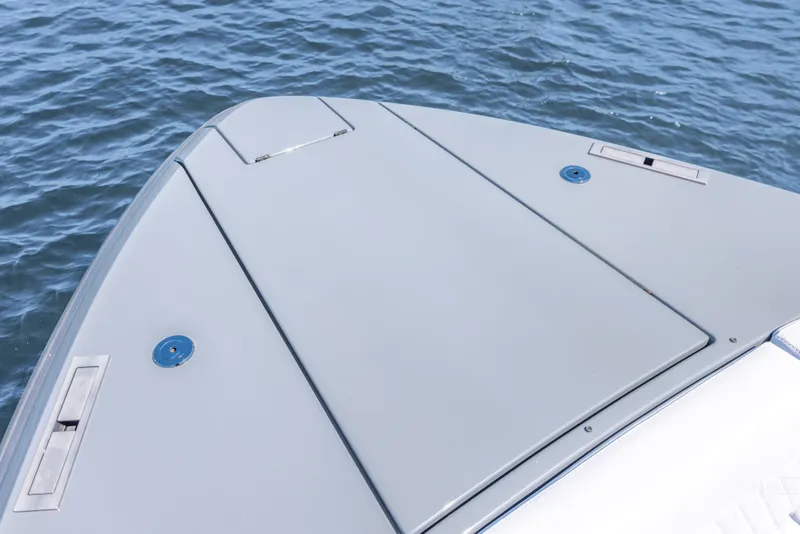 Slide: The Image of Bow of 2025 Vanquish Yachts VQ55 on calm water, showcasing sleek design. - 25