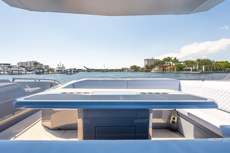 Slide: The Image of Luxurious 2025 Vanquish Yachts VQ55 deck with waterfront view and sleek seating area. - 19