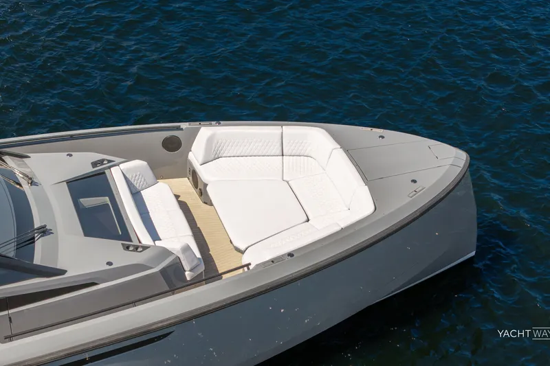 Slide: The Image of Luxury 2025 Vanquish Yachts VQ55 with sleek design and spacious seating on open water. - 17