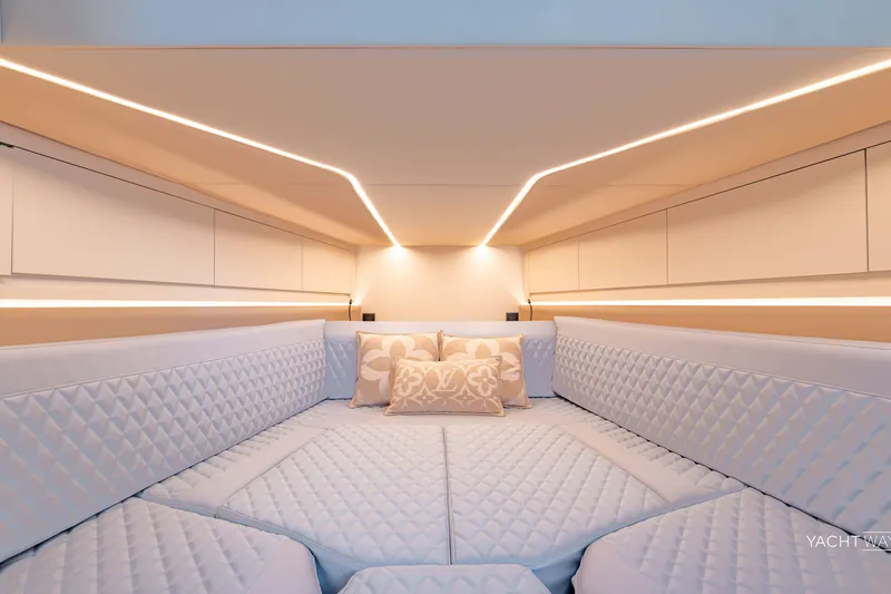 Slide: The Image of Luxurious interior cabin of 2025 Vanquish Yachts VQ55 with elegant lighting and quilted seating. - 38