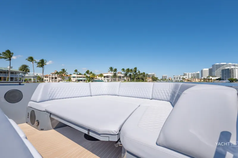 Slide: The Image of Luxurious 2025 Vanquish Yachts VQ55 with spacious seating, set against a coastal backdrop. - 21