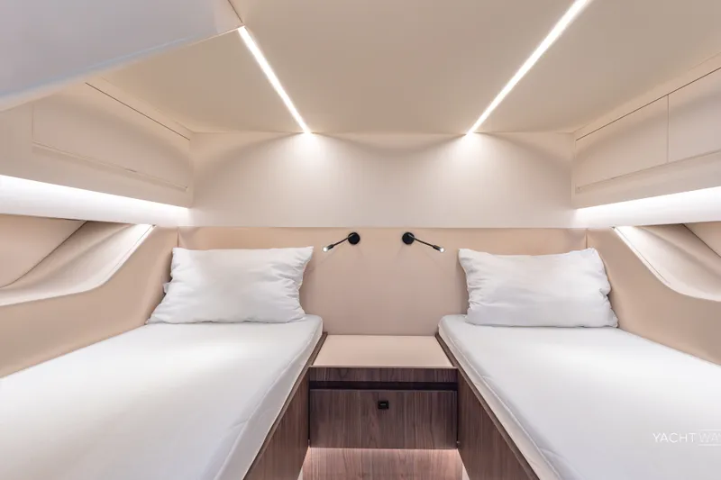 Slide: The Image of Luxurious 2025 Vanquish Yachts VQ55 cabin interior with twin beds and modern lighting. - 40