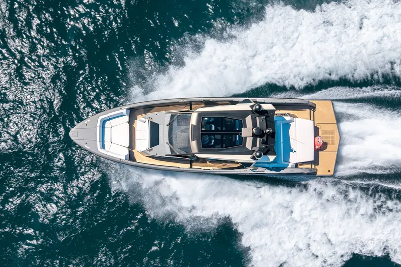 Slide: The Image of Aerial view of 2025 Vanquish Yachts VQ55 cruising on open water. - 3