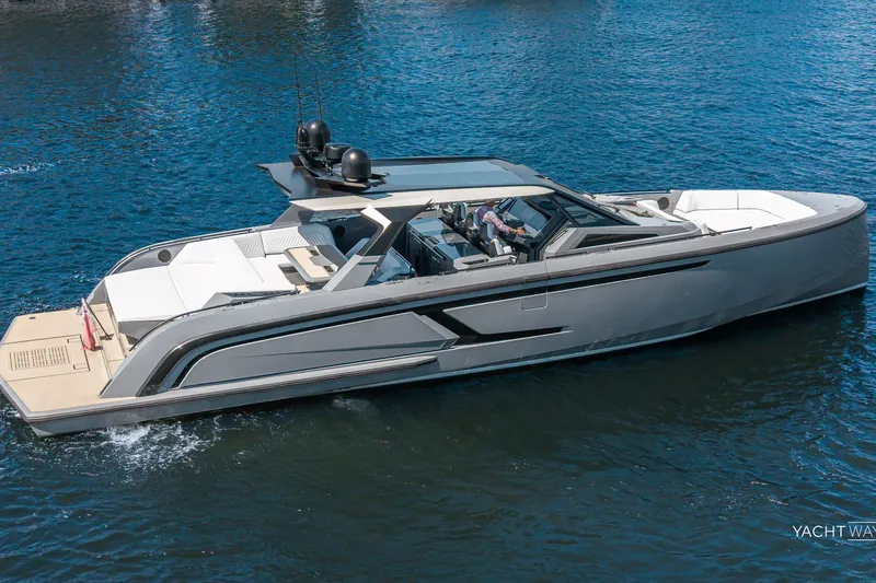 Slide: The Image of 2025 Vanquish Yachts VQ55 luxury yacht cruising on open water. - 13