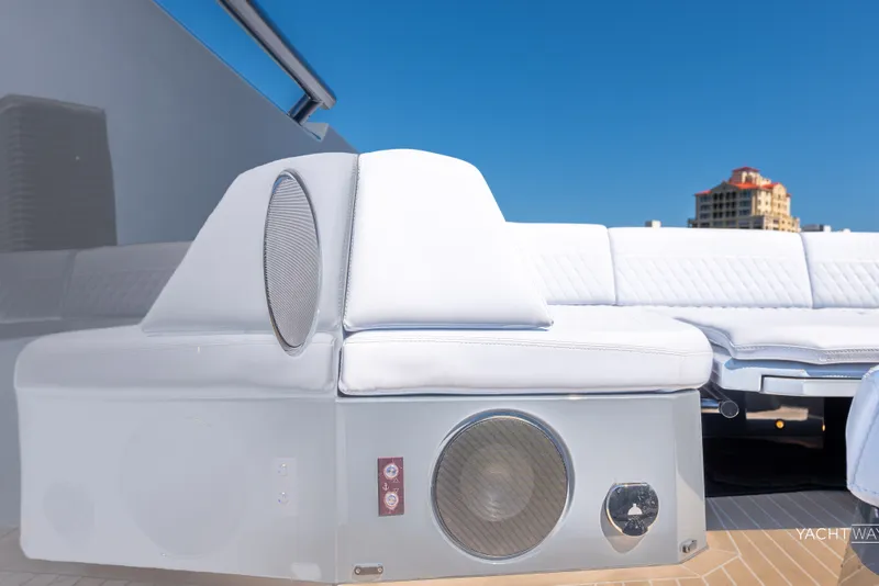 Slide: The Image of Luxurious 2025 Vanquish Yachts VQ55 with sleek white seating and integrated speakers. - 22