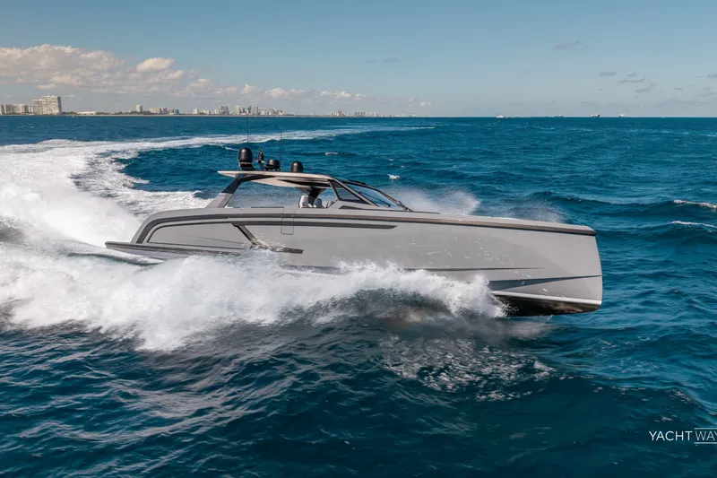 The Image of 2025 Vanquish Yachts VQ55 cruising on open sea under clear skies. - 1