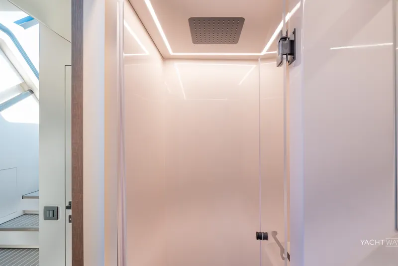 Slide: The Image of Luxurious shower area in the 2025 Vanquish Yachts VQ55, featuring modern design and lighting. - 45