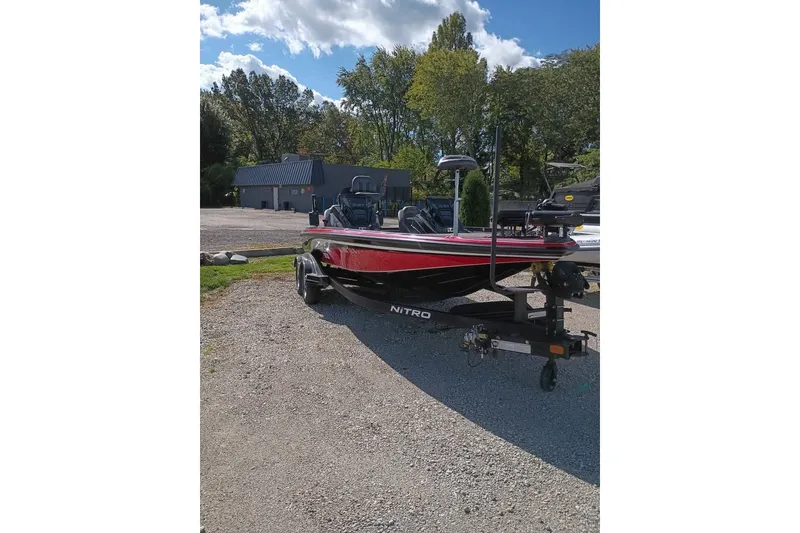 The Image of 2020 Nitro Z21 Pro boat on trailer in sunny outdoor setting. - 0
