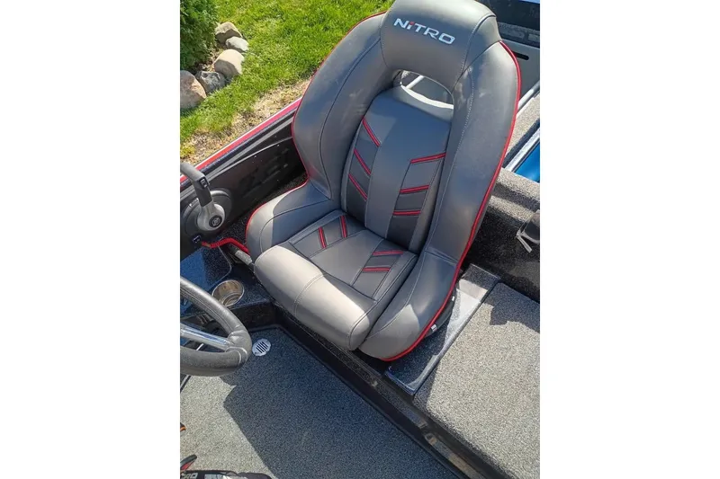 Slide: The Image of 2020 Nitro Z21 Pro boat seat with gray and red accents. - 11