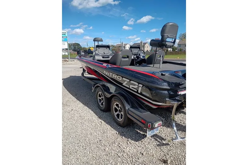 Slide: The Image of 2020 Nitro Z21 Pro boat on trailer, parked outdoors under blue sky. - 3