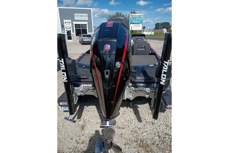 Slide: The Image of 2020 Nitro Z21 Pro boat with Talon anchors, parked outside a boating center. - 5
