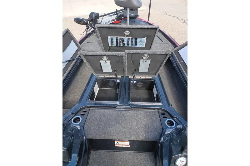 Slide: The Image of 2020 Nitro Z21 Pro boat interior with open storage compartments and fishing gear setup. - 6