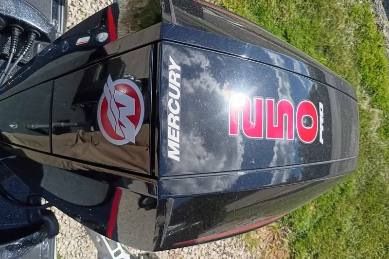 Slide: The Image of 2020 Nitro Z21 Pro boat engine with Mercury branding, reflecting sky and clouds. - 4
