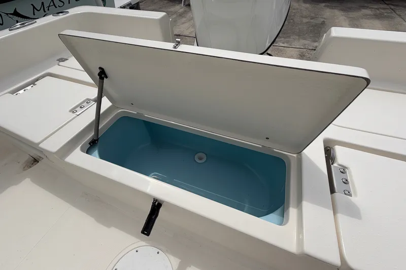 Slide: The Image of Open storage compartment on a 2027 Bulls Bay 2200 XS boat. - 16