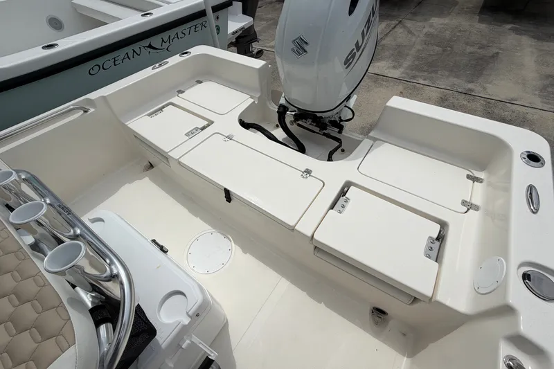 Slide: The Image of 2027 Bulls Bay 2200 XS boat with Suzuki outboard motor and storage compartments. - 15