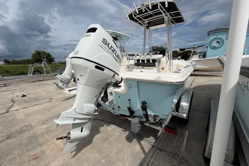 Slide: The Image of 2027 Bulls Bay 2200 XS boat with Suzuki outboard motor on trailer. - 5