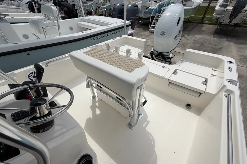 Slide: The Image of 2027 Bulls Bay 2200 XS boat interior with steering wheel and seating. - 14