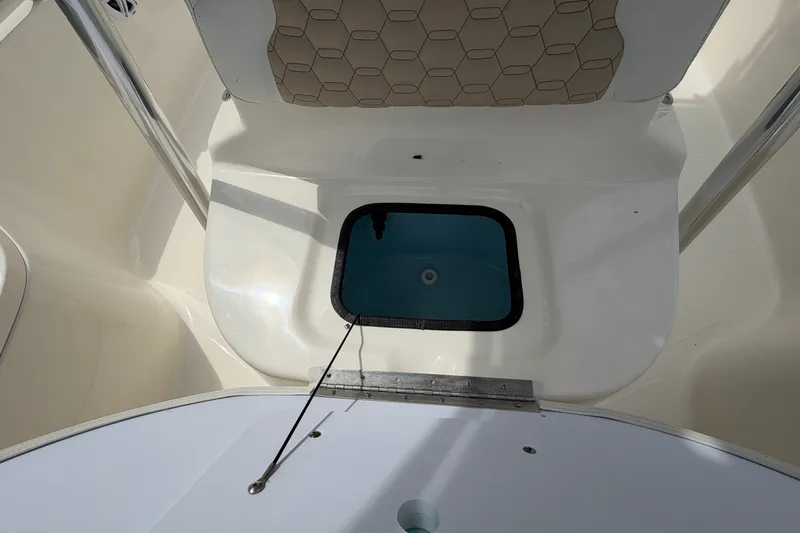 Slide: The Image of Bulls Bay 2200 XS 2027 boat interior with open storage compartment. - 13